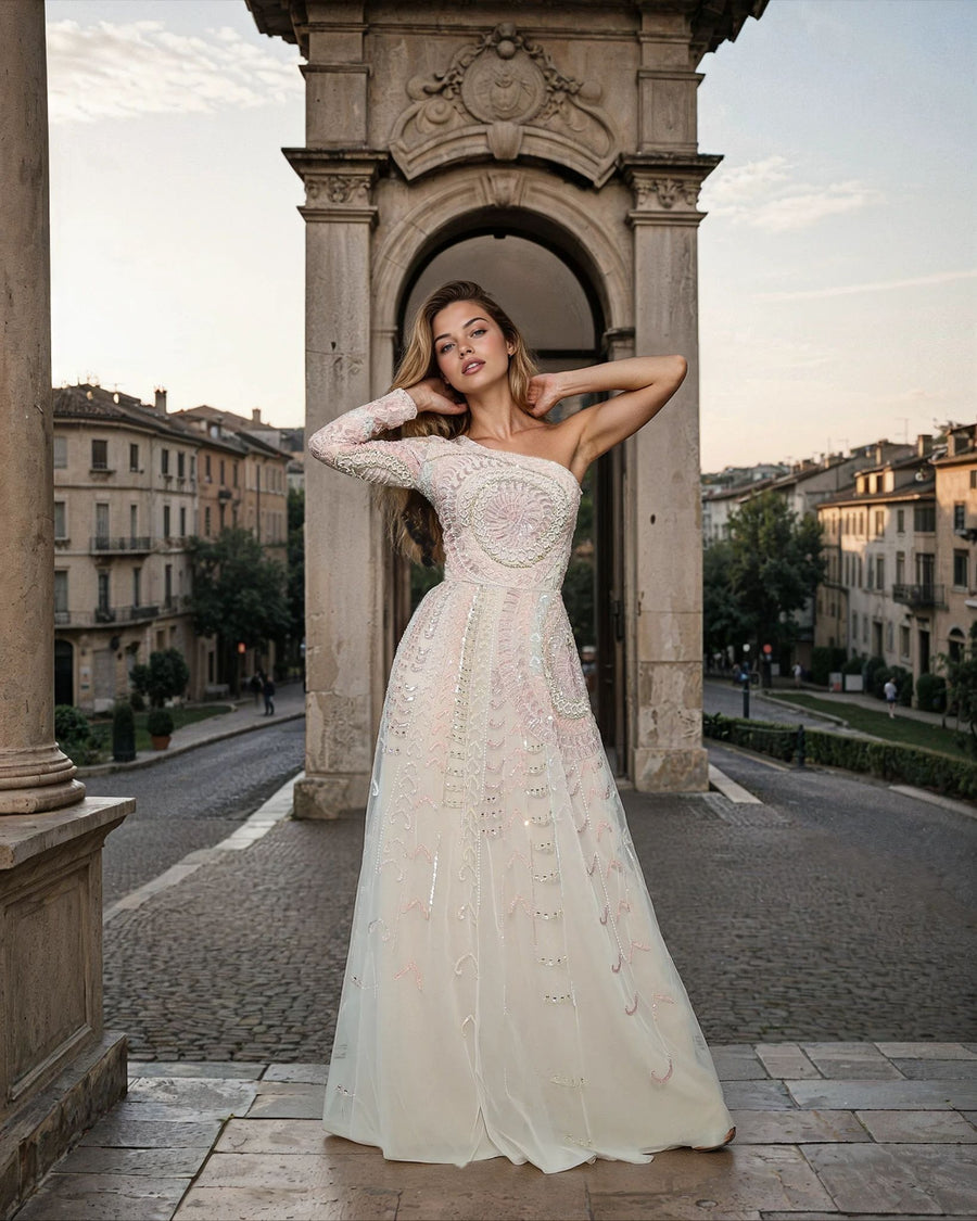 Kos Couture One-Shoulder Embellished Ivory Gown with Long Sleeve and Flowing Skirt
