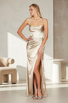 A stunning champagne-colored prom dress featuring a draped corset design and a flowing cowl neckline, elegantly cascading to the floor.