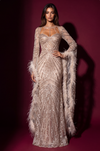 Model wearing the Champagne long-sleeve sequin gown, front view